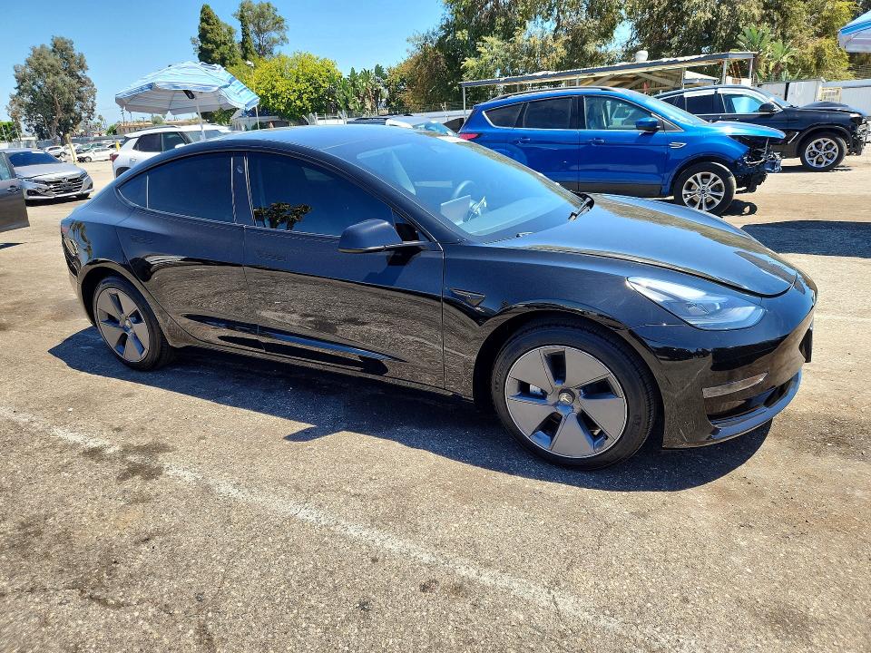 2023 Tesla Model 3 VIN 5YJ3E1EA7PF698947 COPART salvage auction — NORMAL WEAR, Ca - Salvage Certificate (P), sold $13,700 on 2026-07-24 (photo 4)