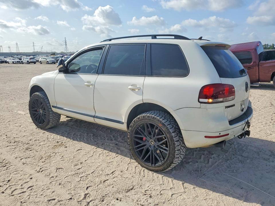 2010 Volkswagen Touareg VIN WVGFK7A93AD000946 COPART salvage auction — SIDE, TX - SALVAGE VEHICLE TITLE (P), sold $1,600 on 2026-08-07 (photo 2)