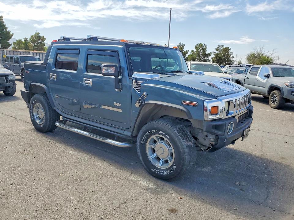 2005 Hummer H2 VIN 5GRGN22U95H115294 COPART salvage auction — MINOR DENT/SCRATCHES, Tx - Cert Of Title-Rebuilt Salvage (P), sold $9,700 on 2026-07-28 (photo 4)