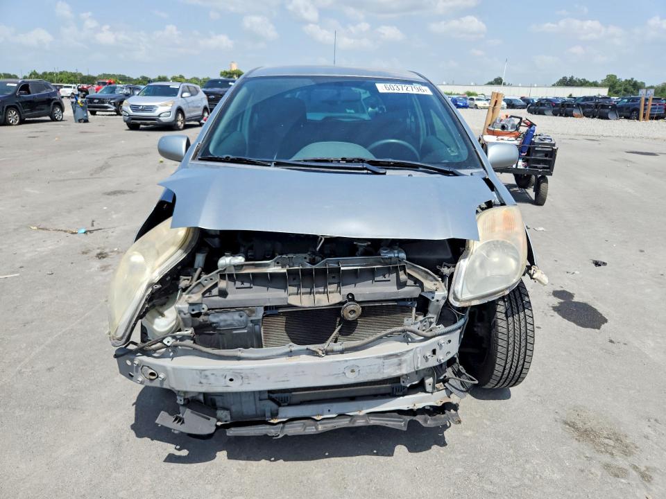2010 Toyota Yaris VIN JTDJT4K31A5302511 COPART salvage auction — FRONT END, FL - CERT OF TITLE SLVG REBUILDABLE, sold $250 on 2026-07-22 (photo 5)