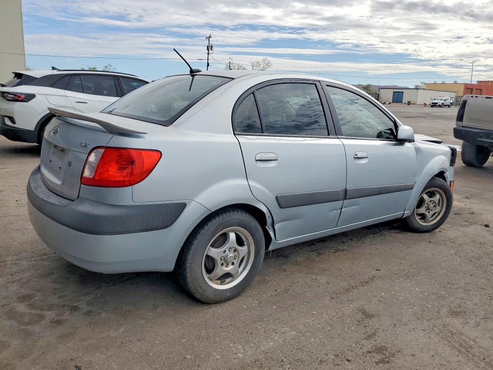 2009 Kia Rio VIN KNADE223X96451207 COPART salvage auction — FRONT END, TX - SALVAGE VEHICLE TITLE (P), sold $125 on 2026-07-31 (photo 3)