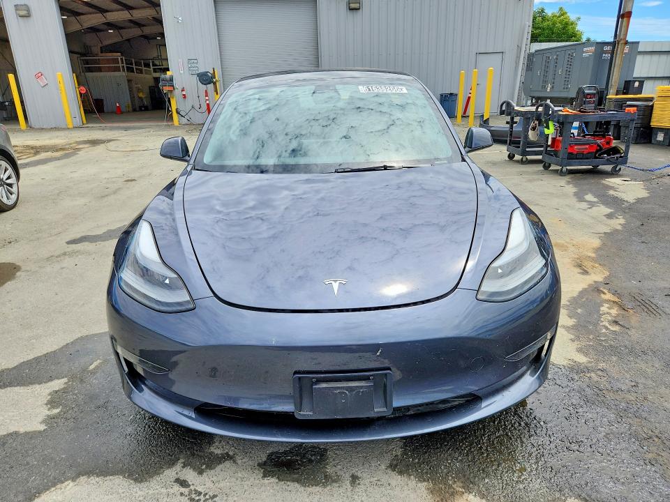 2023 Tesla Model 3 VIN 5YJ3E1EA4PF687985 COPART salvage auction — REAR END, CA - CERTIFICATE OF TITLE (P), sold $17,000 on 2026-07-27 (photo 5)