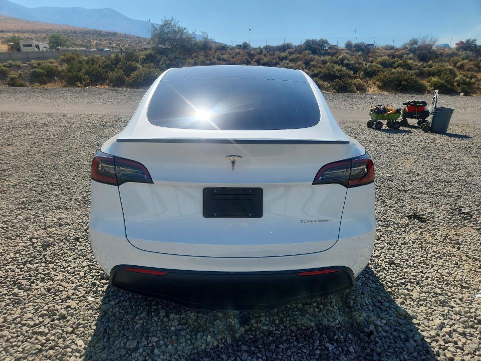 2023 Tesla Model y VIN 7SAYGDEE0PA112691 COPART salvage auction — SIDE, Nv - Salvage Title, sold $11,500 on 2026-08-27 (photo 6)