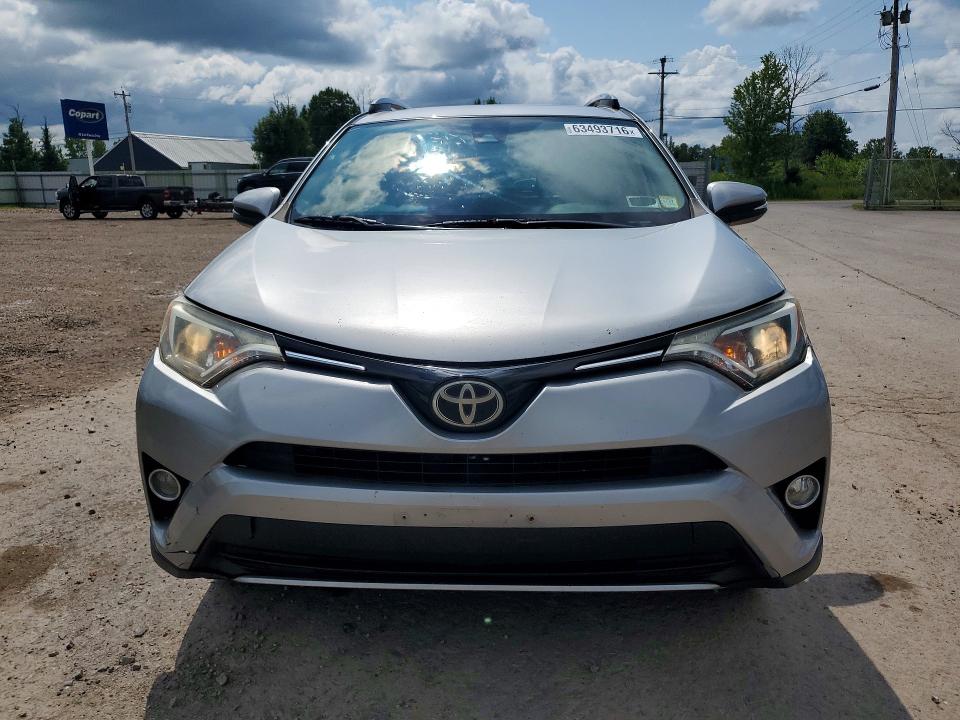 2017 Toyota Rav4 VIN 2T3RFREV6HW686468 COPART salvage auction — MINOR DENT/SCRATCHES, Ny - Cert Of Title-Rebuilt Salvage, sold $11,500 on 2026-08-19 (photo 5)