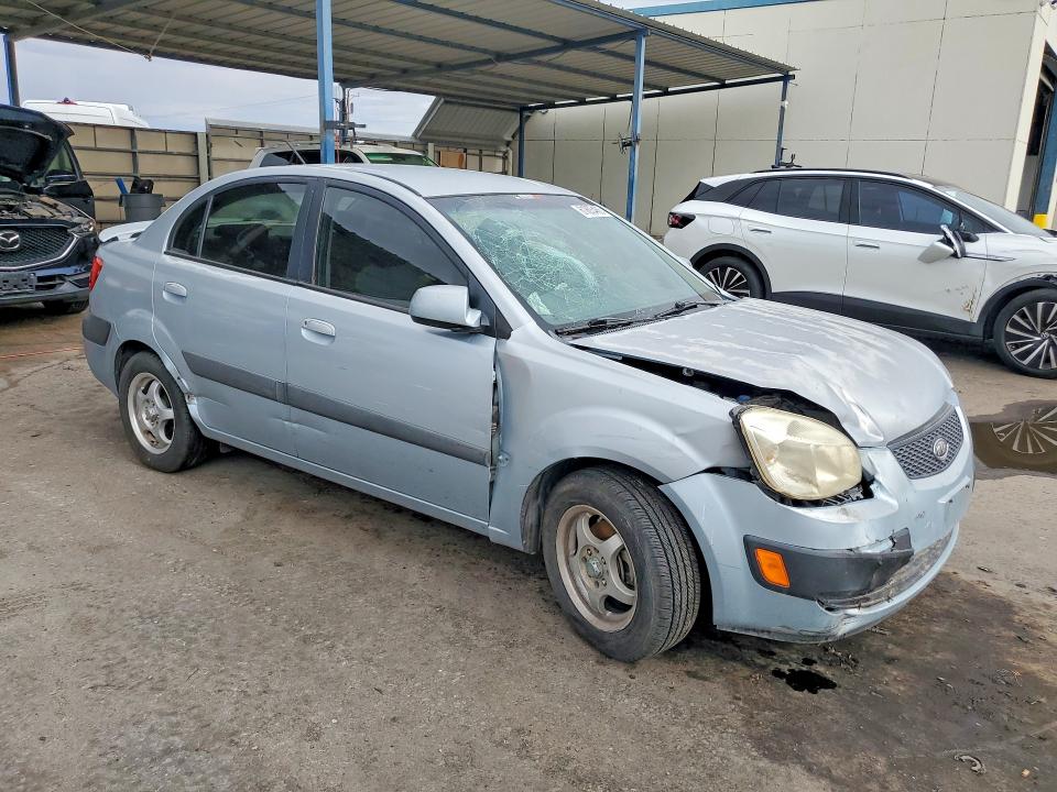 2009 Kia Rio VIN KNADE223X96451207 COPART salvage auction — FRONT END, TX - SALVAGE VEHICLE TITLE (P), sold $125 on 2026-07-31 (photo 4)
