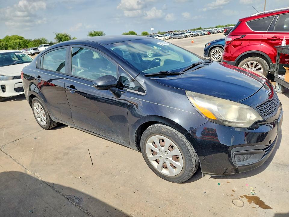 2015 Kia Rio VIN KNADM4A39F6527091 COPART salvage auction — NORMAL WEAR, Tx - Certificate Of Title, sold $975 on 2026-07-30 (photo 4)
