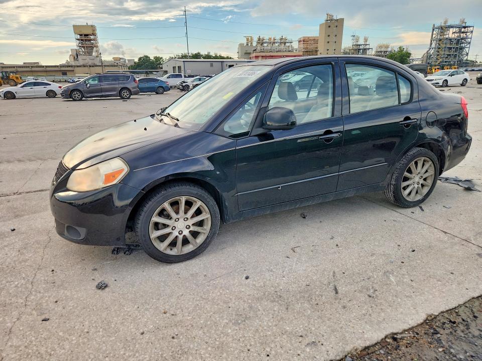 2011 Suzuki Sx4 VIN JS2YC5A21B6303012 COPART salvage auction — MINOR DENT/SCRATCHES, La - Certificate Of Title (P), sold $750 on 2026-07-29 (photo 1)
