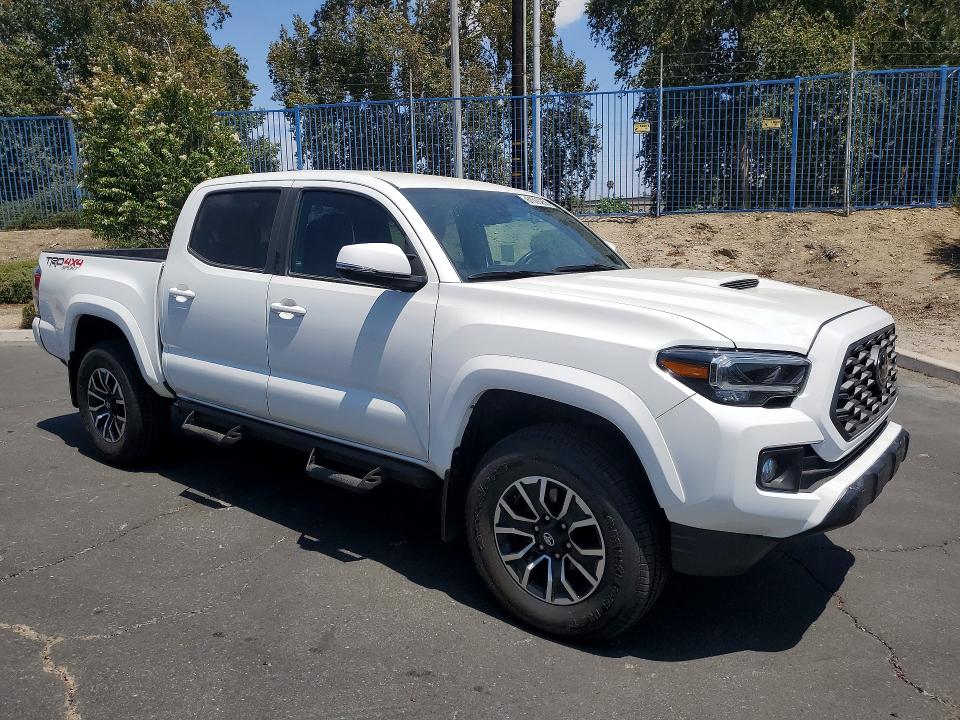2023 Toyota Tacoma VIN 3TMCZ5ANXPM640220 COPART salvage auction — MINOR DENT/SCRATCHES, CA - DIS/DLR/EXP ONLY CLEAN TITLE (P), sold $27,500 on 2026-07-30 (photo 4)
