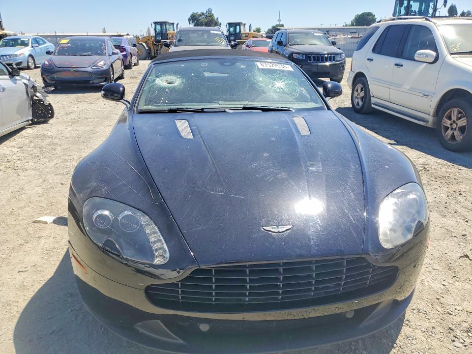 2014 Aston martin VIN SCFEKBBK0EGD18195 COPART salvage auction — VANDALISM, In - Dis/Dlr/Exp Only Clean Title, sold $21,100 on 2026-09-01 (photo 5)
