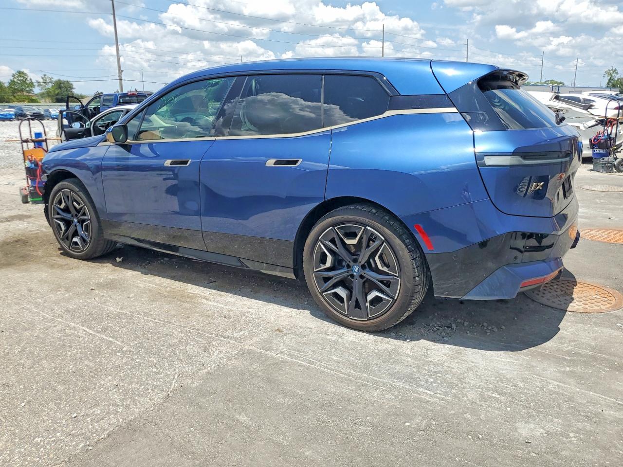 2024 BMW iX VIN WB523CF06RCR08663 COPART salvage auction — Side, FL - CERTIFICATE OF DESTRUCTION, sold $20,100 on 2026-08-28 (photo 2)