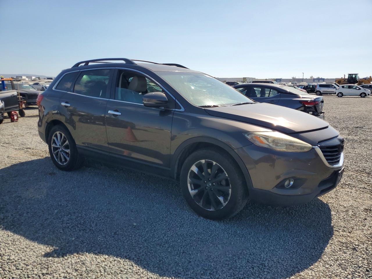 2015 Mazda CX-9 VIN JM3TB2DV7F0447255 COPART salvage auction — Rear End, CA - DIS/DLR/EXP ONLY CLEAN TITLE, sold $325 on 2026-09-11 (photo 4)