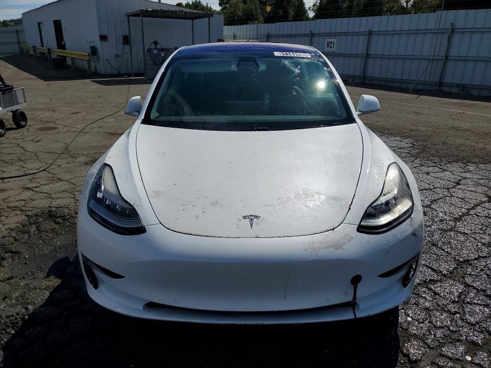 2018 Tesla Model 3 VIN 5YJ3E1EA1JF013218 COPART salvage auction — MINOR DENT/SCRATCHES, Ca - Certificate Of Title, sold $17,007 on 2026-09-01 (photo 5)