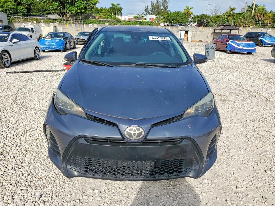 2017 Toyota Corolla VIN 5YFBURHE8HP616757 COPART salvage auction — SIDE, Fl - Cert Of Title Slvg Rebuildable, sold $2,100 on 2026-07-28 (photo 5)