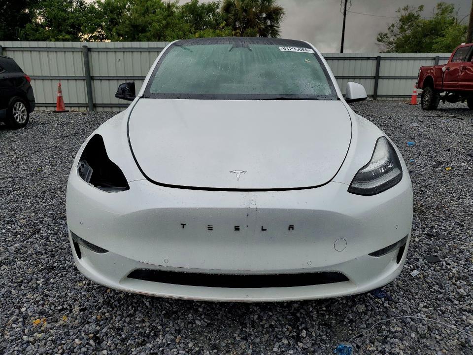 2022 Tesla Model y VIN 7SAYGDEEXNA017150 COPART salvage auction — ALL OVER, FL - CERT OF TITLE SLVG REBUILDABLE, sold $5,500 on 2026-07-24 (photo 5)