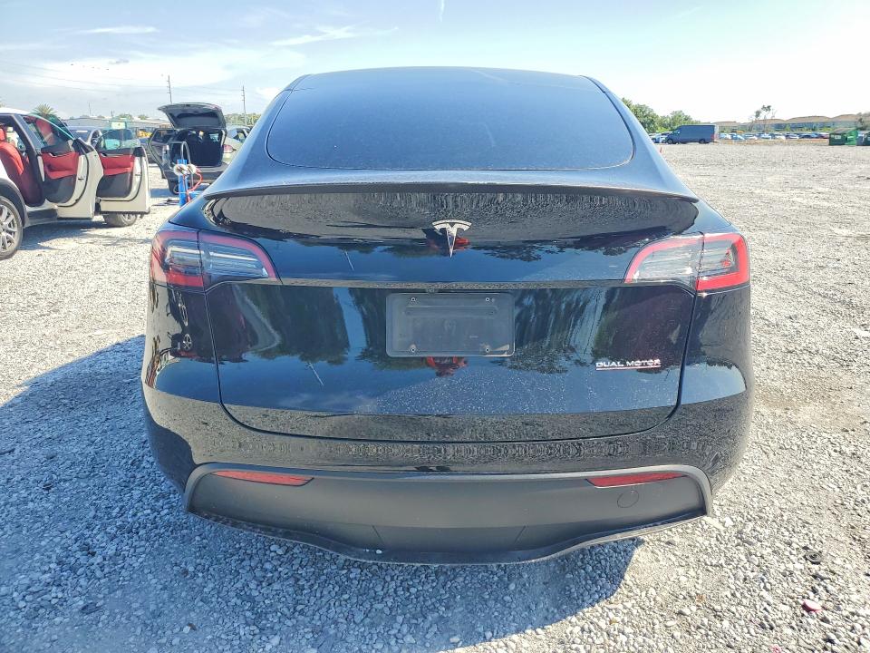2023 Tesla Model y VIN 7SAYGDEF6PF844075 COPART salvage auction — SIDE, Fl - Cert Of Title Slvg Rebuildable, sold $9,700 on 2026-07-31 (photo 6)