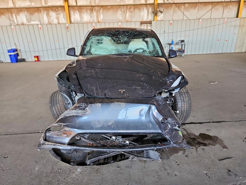 2023 Tesla Model y VIN 7SAYGDEE9PF709423 COPART salvage auction — ALL OVER, AZ - CERT OF TITLE- NON REPAIR, sold $3,050 on 2026-07-27 (photo 5)