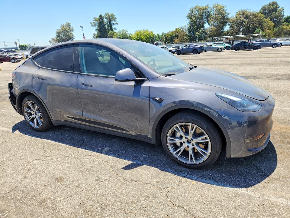 2023 Tesla Model y VIN 7SAYGDEE8PF918877 COPART salvage auction — REAR END, CA - SALVAGE CERTIFICATE, sold $15,700 on 2026-07-24 (photo 4)