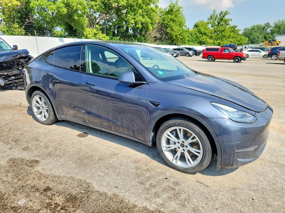 2023 Tesla Model y VIN 7SAYGDEF5PA049323 COPART salvage auction — NORMAL WEAR, MO - CERTIFICATE OF TITLE, sold $9,000 on 2026-07-28 (photo 4)
