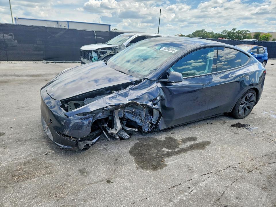 2024 Tesla Model y VIN 7SAYGDED5RF161043 COPART salvage auction — UNDERCARRIAGE, Fl - Certificate Of Title, sold $9,700 on 2026-07-21 (photo 1)