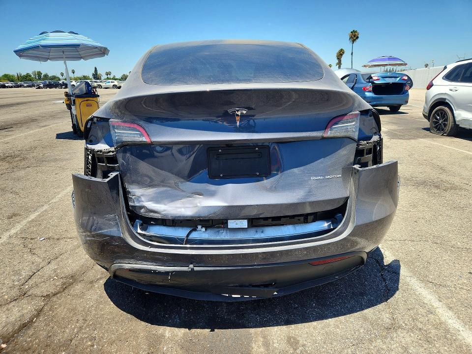 2023 Tesla Model y VIN 7SAYGDEE8PF918877 COPART salvage auction — REAR END, CA - SALVAGE CERTIFICATE, sold $15,700 on 2026-07-24 (photo 6)