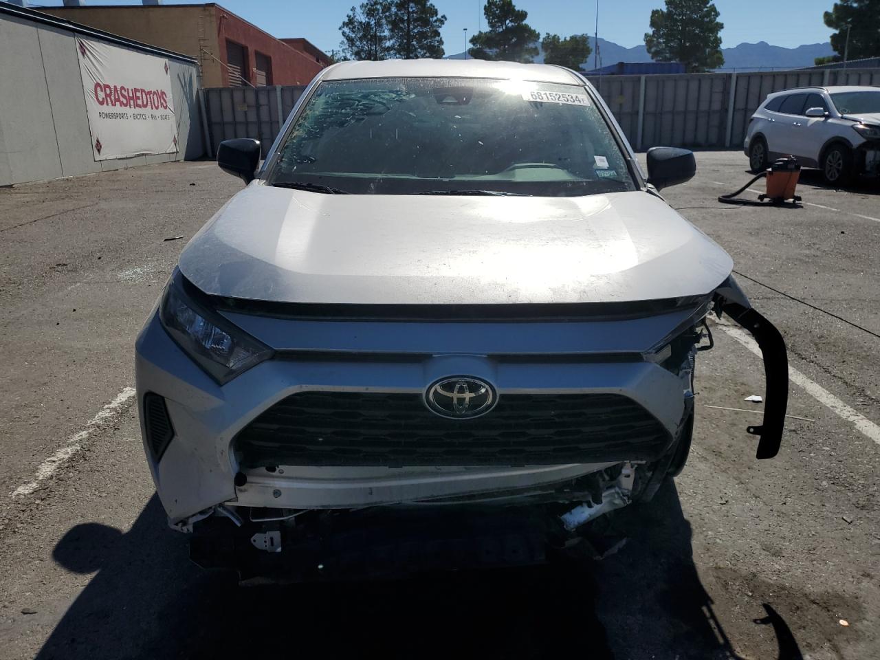 2022 Toyota RAV4 VIN 2T3H1RFV2NC209882 COPART salvage auction — FRONT END, TX - SALVAGE VEHICLE TITLE, sold $7,700 on 2024-10-11 (photo 5)