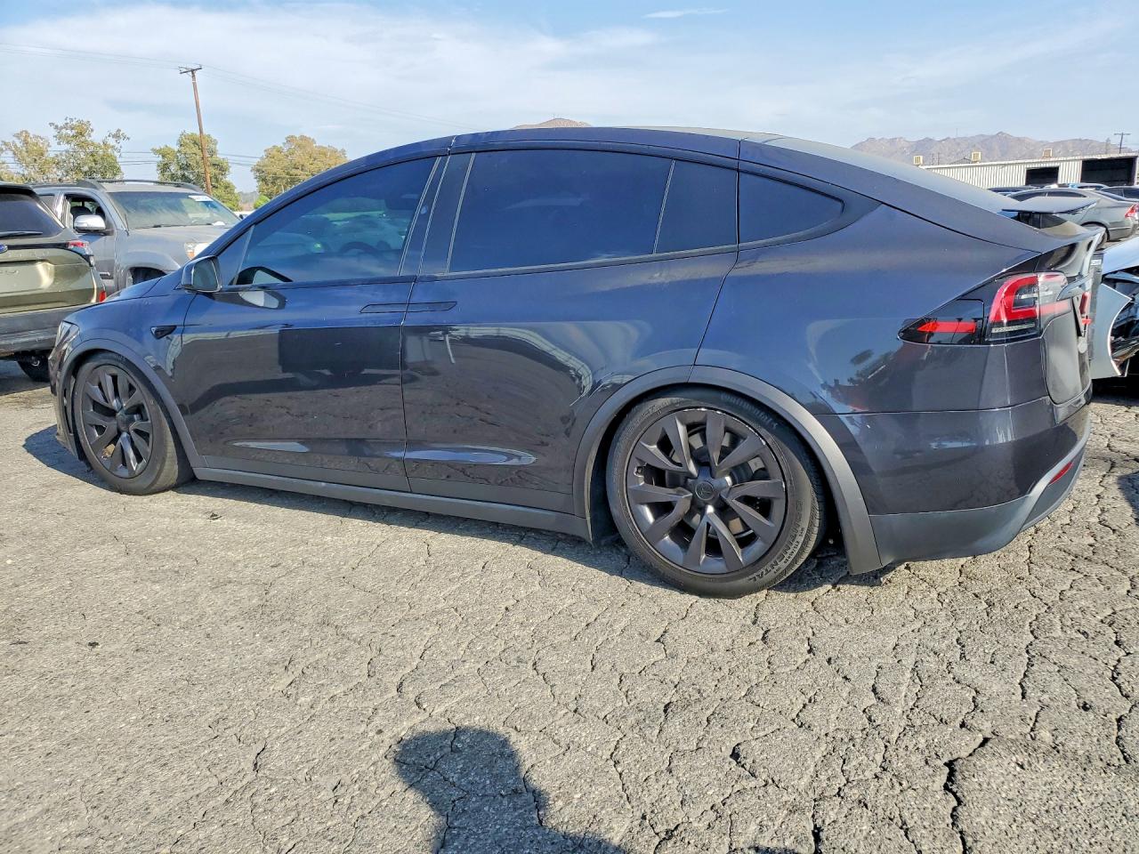 2024 Tesla Model X VIN 7SAXCDE53RF443181 COPART salvage auction — Side, Sc - Salvage Title, sold $30,500 on 2026-09-24 (photo 2)