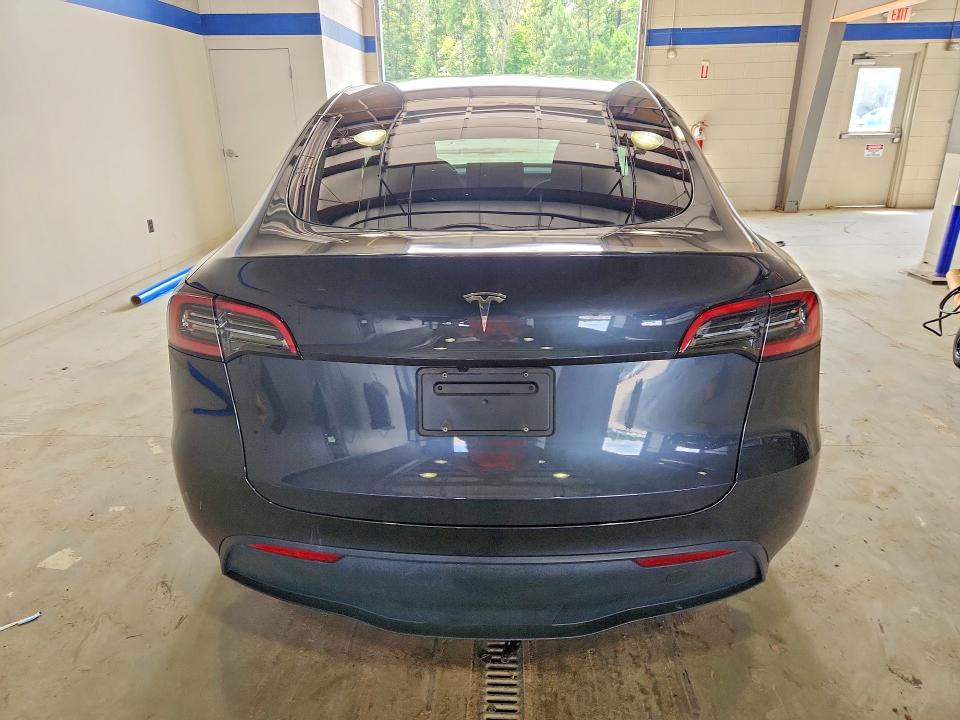 2025 Tesla Model y VIN 7SAYGDED9SF264861 COPART salvage auction — SIDE, VA, sold $14,400 on 2026-10-16 (photo 6)