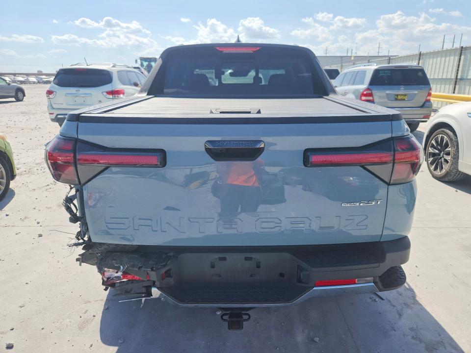 2022 Hyundai Santa cruz VIN 5NTJEDAF0NH021748 COPART salvage auction — REAR END, TX - SALVAGE VEHICLE TITLE, sold $11,000 on 2026-08-28 (photo 6)