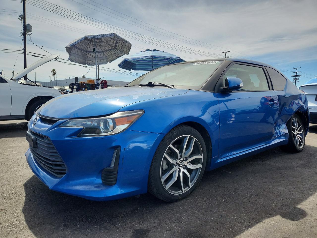 2014 Scion tC VIN JTKJF5C75E3076434 COPART salvage auction — Side, Sc - Salvage Title, sold $1,500 on 2026-09-16 (photo 1)