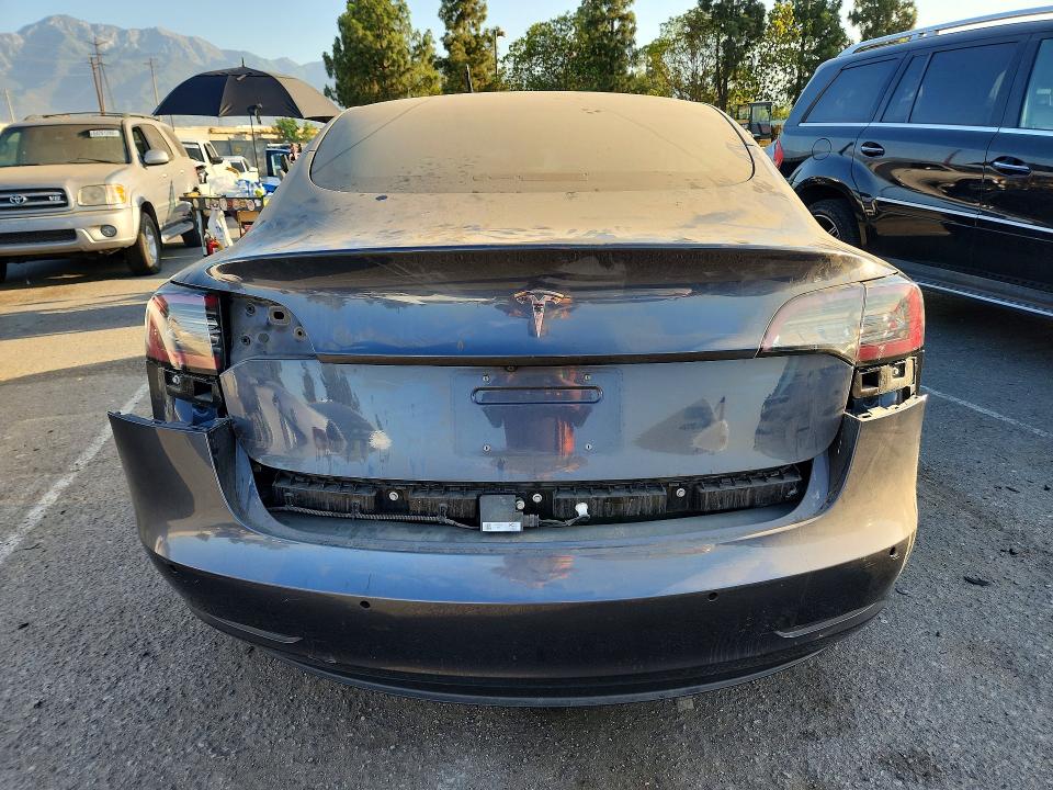 2018 Tesla Model 3 VIN 5YJ3E1EA3JF157661 COPART salvage auction — ALL OVER, CA - DIS/DLR/EXP ONLY CLEAN TITLE (P), sold $1,550 on 2026-10-08 (photo 6)