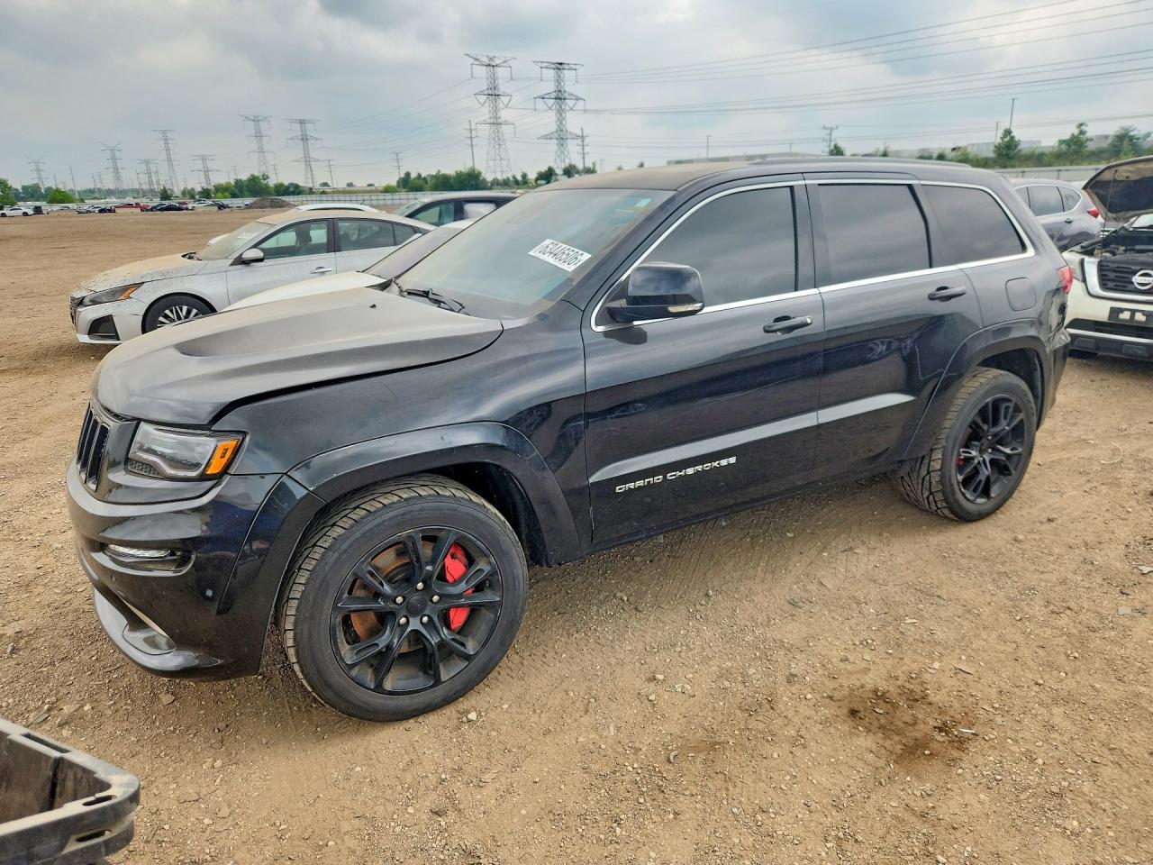 2014 Jeep Grand Cherokee VIN 1C4RJFDJ7EC306533 — COPART salvage auction photo