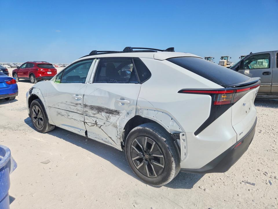 2026 Toyota Bz4x VIN JTMBCAEBXTJ007147 COPART salvage auction — SIDE, Tx - Salvage Vehicle Title, sold $10,600 on 2026-08-13 (photo 2)