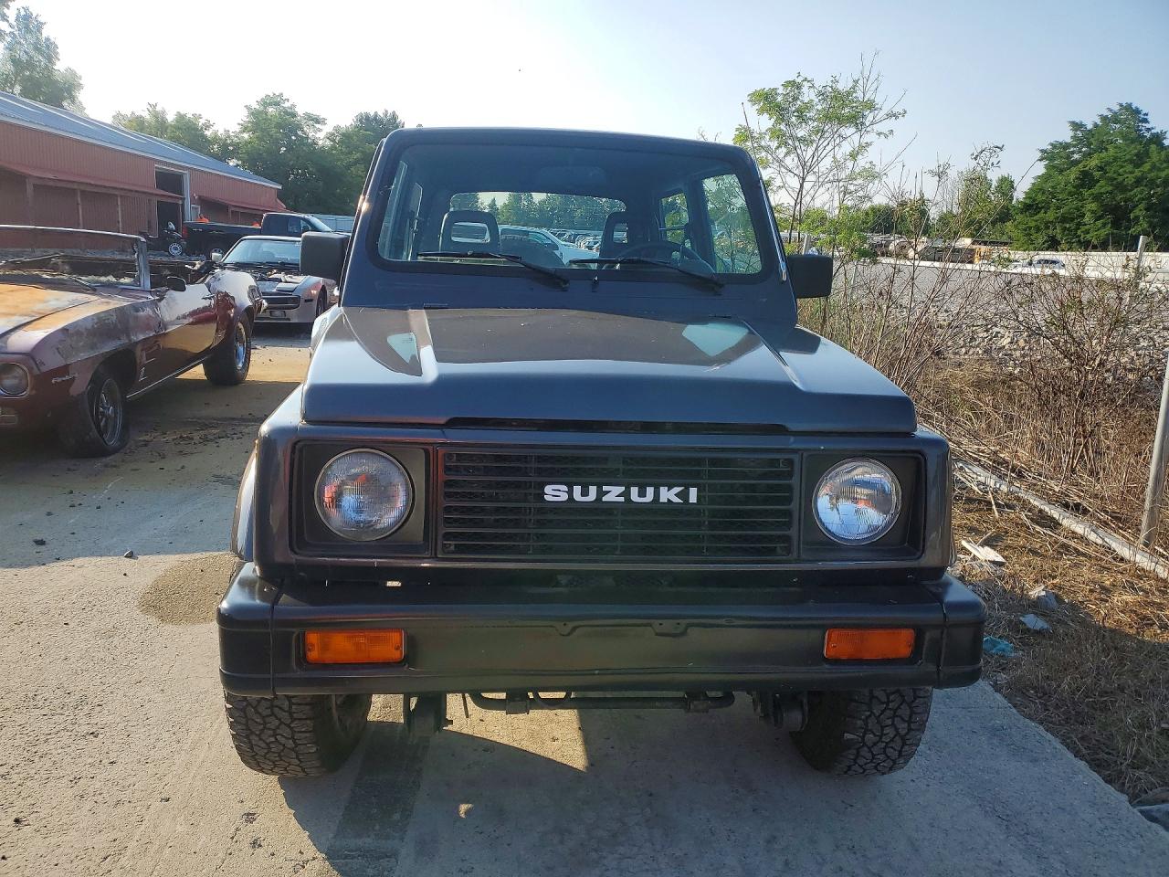 1986 Suzuki Samurai VIN JS3JC51V8G4110639 COPART salvage auction — Water/Flood, FL - CERT OF TITLE-SLVG REBLD FLOOD (P), sold $3,100 on 2026-09-09 (photo 5)