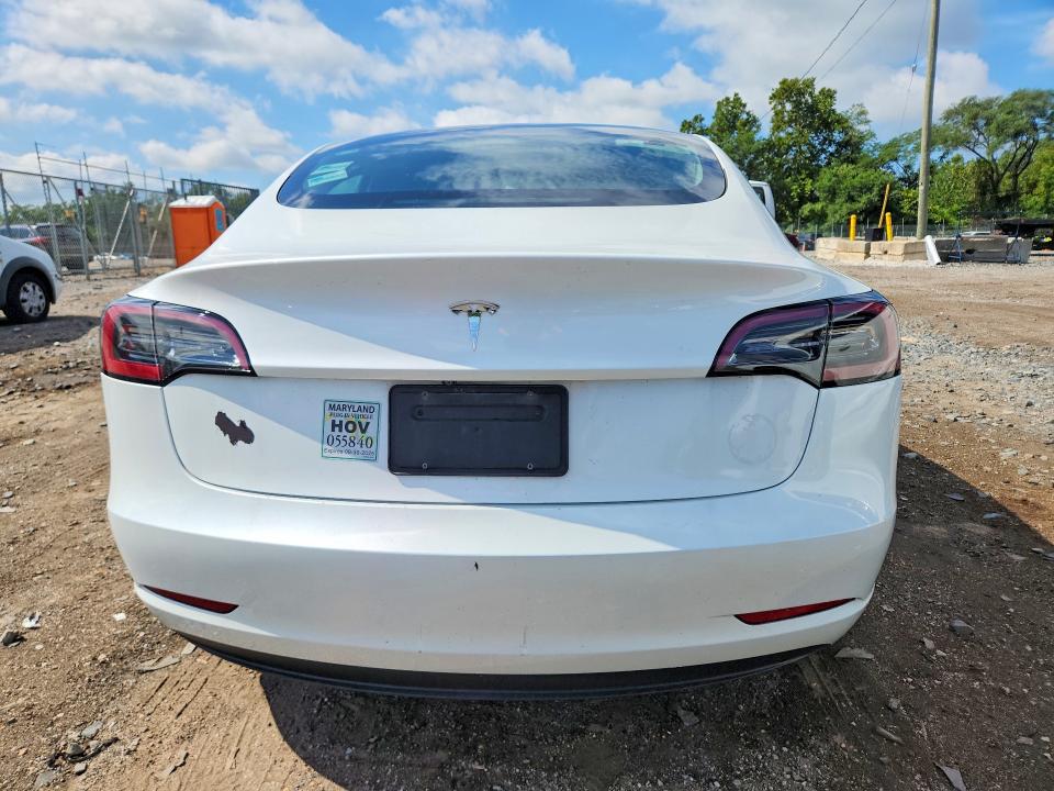 2023 Tesla Model 3 VIN 5YJ3E1EA7PF566075 COPART salvage auction — SIDE, Md - Certificate Of Title, sold $10,600 on 2026-09-03 (photo 6)