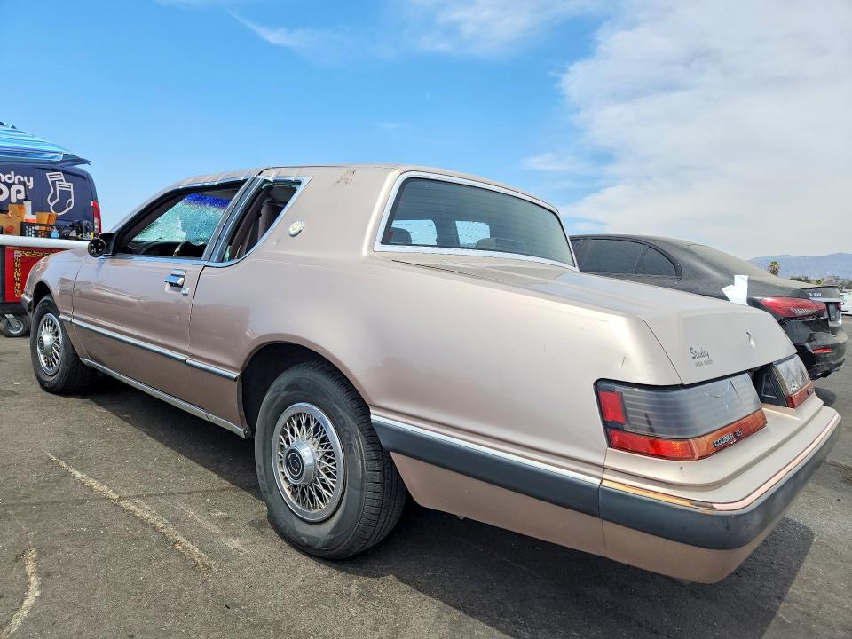 1986 Mercury Cougar VIN 1MEBP92F3GH728237 COPART salvage auction — VANDALISM, CA - DIS/DLR/EXP ONLY CLEAN TITLE, sold $225 on 2026-08-26 (photo 2)