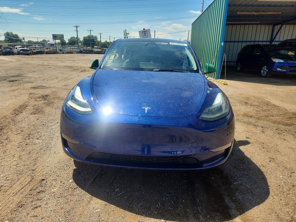 2023 Tesla Model y VIN 7SAYGDEE8PF863637 COPART salvage auction — ALL OVER, CO - SALVAGE TITLE, sold $7,100 on 2026-09-04 (photo 5)