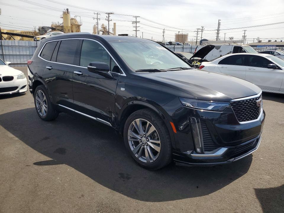 2023 Cadillac Xt6 VIN 1GYKPCRS4PZ220185 COPART salvage auction — SIDE, Ca - Salvage Certificate (P), sold $10,800 on 2026-08-26 (photo 4)