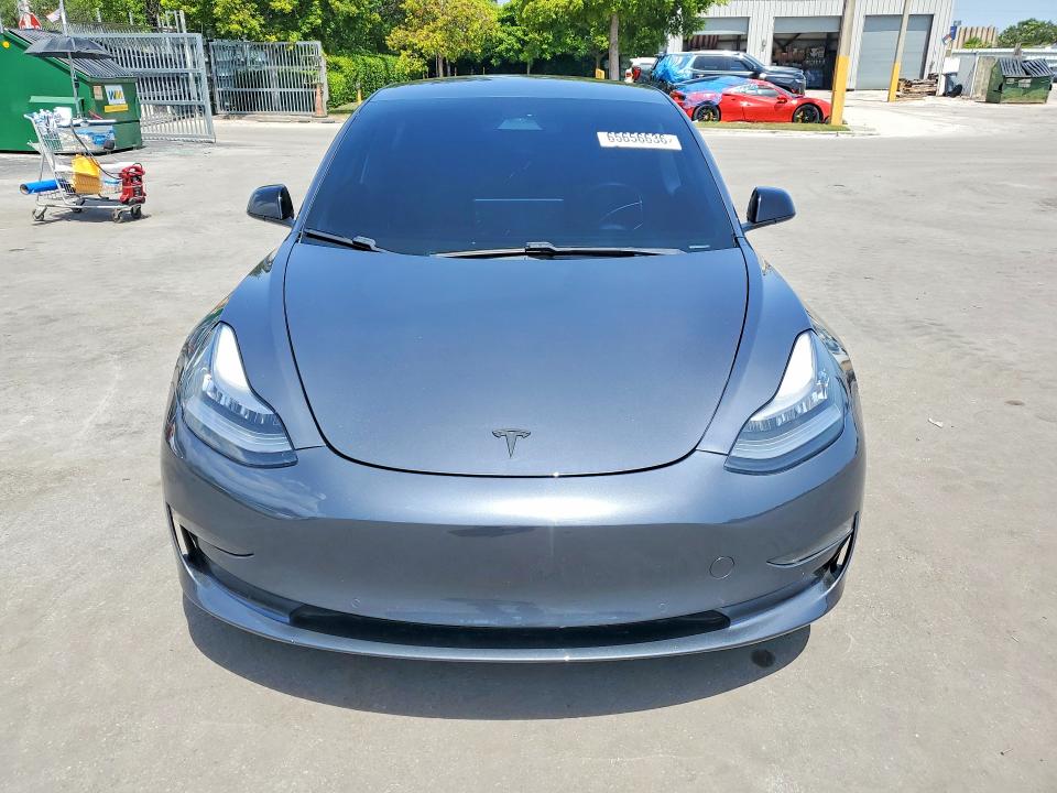 2021 Tesla Model 3 VIN 5YJ3E1EA8MF854022 COPART salvage auction — MINOR DENT/SCRATCHES, Fl - Cert Of Title-Rebuilt, sold $8,600 on 2026-09-09 (photo 5)