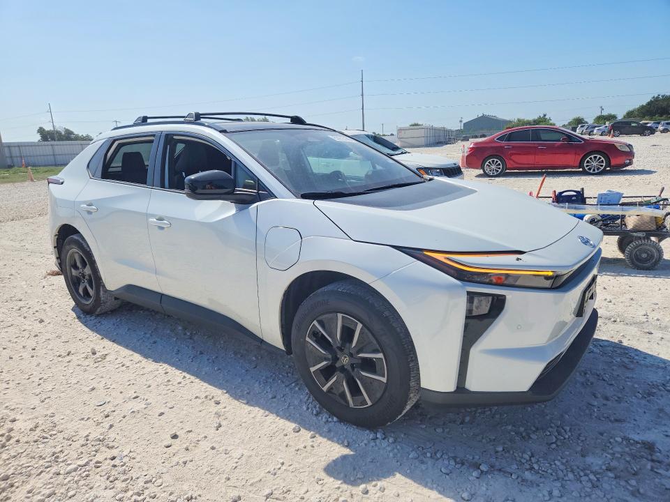 2026 Toyota Bz4x VIN JTMBCAEBXTJ007147 COPART salvage auction — SIDE, Tx - Salvage Vehicle Title, sold $10,600 on 2026-08-13 (photo 4)