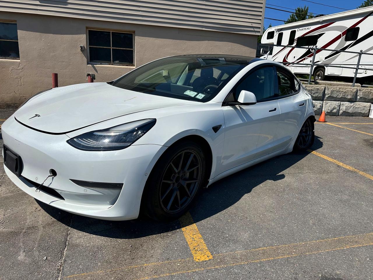 2021 Tesla Model 3 VIN 5YJ3E1EA9MF857852 — COPART salvage auction photo