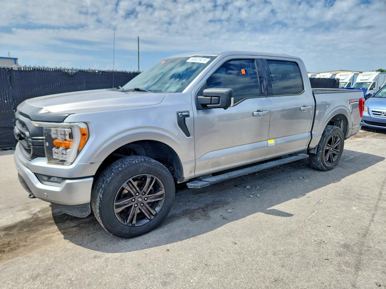 2021 Ford F-150 Lightning VIN 1FTFW1E82MFA22114 — COPART salvage auction photo