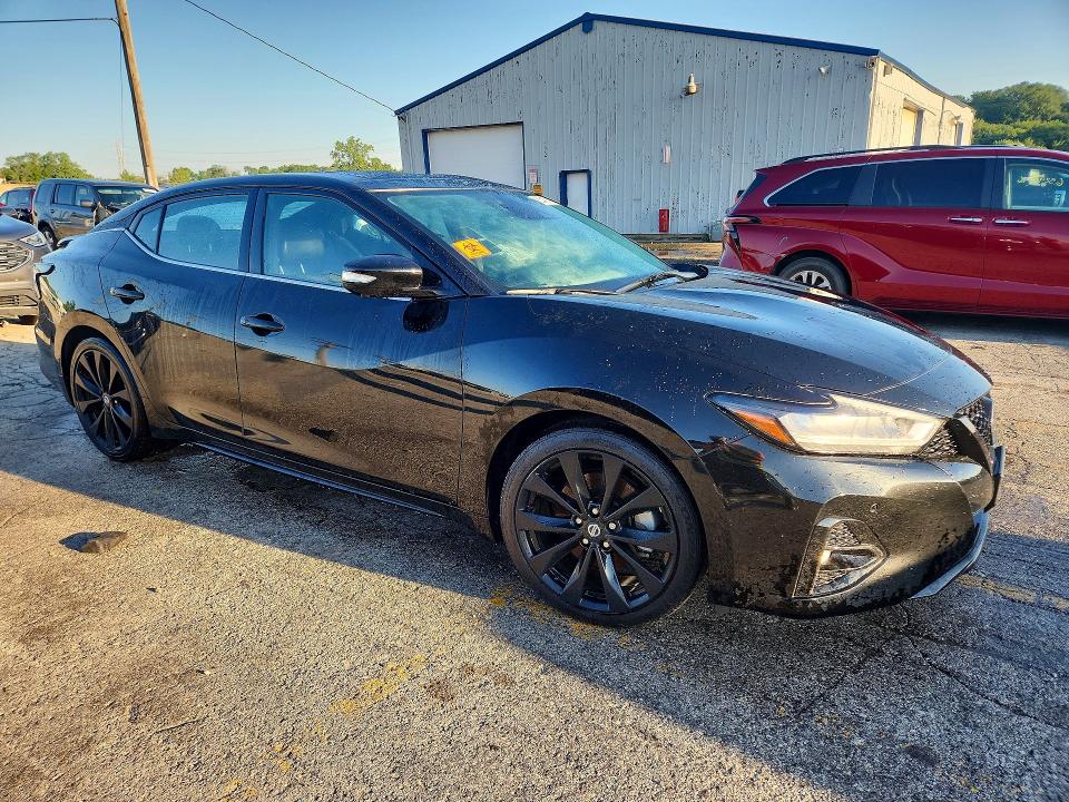 2021 Nissan Maxima VIN 1N4AA6EV9MC510382 COPART salvage auction — VANDALISM, IL - SALVAGE CERTIFICATE, sold $10,100 on 2026-10-07 (photo 4)