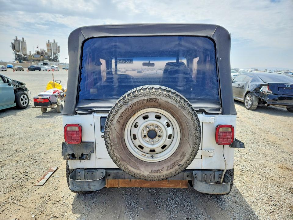 1993 Jeep Wrangler / VIN 1J4FY19P3PP219989 COPART salvage auction — FRONT END, CA - DIS/DLR/EXP ONLY CLEAN TITLE, sold $1,600 on 2026-08-21 (photo 6)