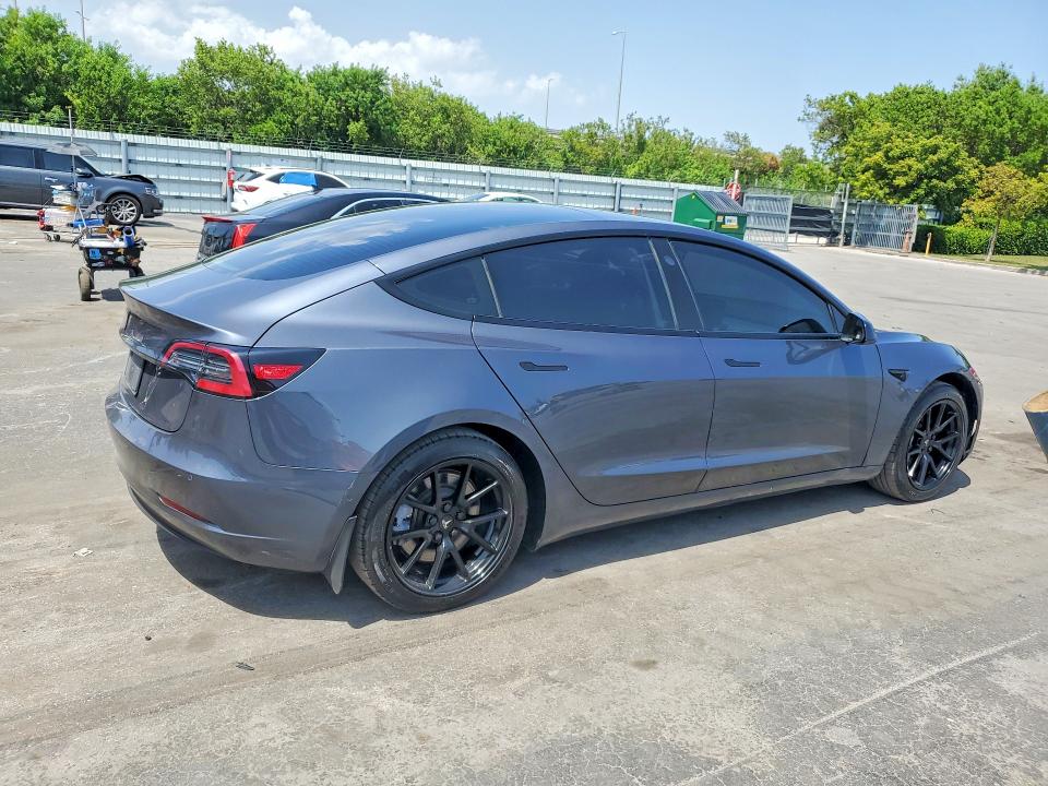 2021 Tesla Model 3 VIN 5YJ3E1EA8MF854022 COPART salvage auction — MINOR DENT/SCRATCHES, Fl - Cert Of Title-Rebuilt, sold $8,600 on 2026-09-09 (photo 3)