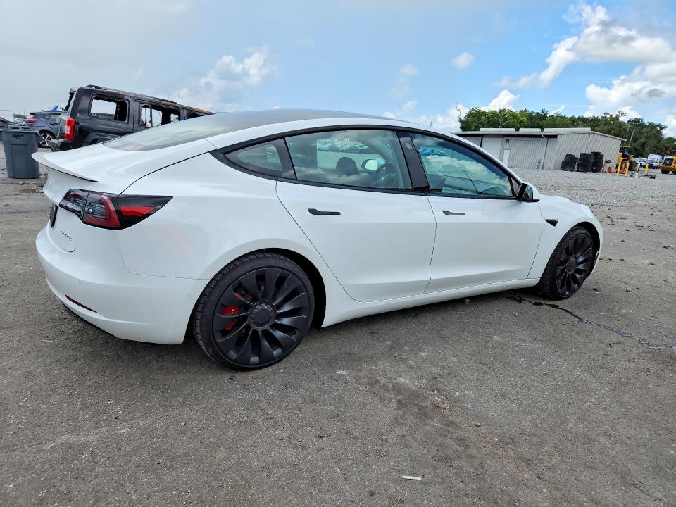 2021 Tesla Model 3 VIN 5YJ3E1EC2MF926480 COPART salvage auction — MINOR DENT/SCRATCHES, Fl - Cert Of Title-Rebuilt, sold $10,000 on 2026-08-28 (photo 3)