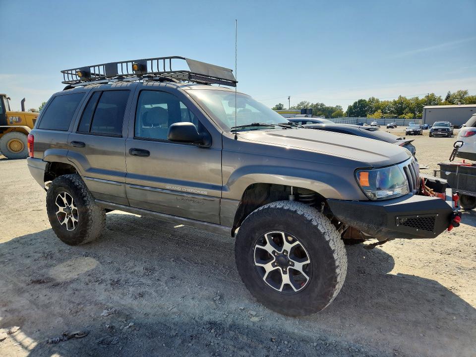 1999 Jeep Grand cherokee VIN 1J4GW58S5XC687799 COPART salvage auction — MINOR DENT/SCRATCHES, CA - DIS/DLR/EXP ONLY CLEAN TITLE, sold $1,500 on 2026-09-01 (photo 4)
