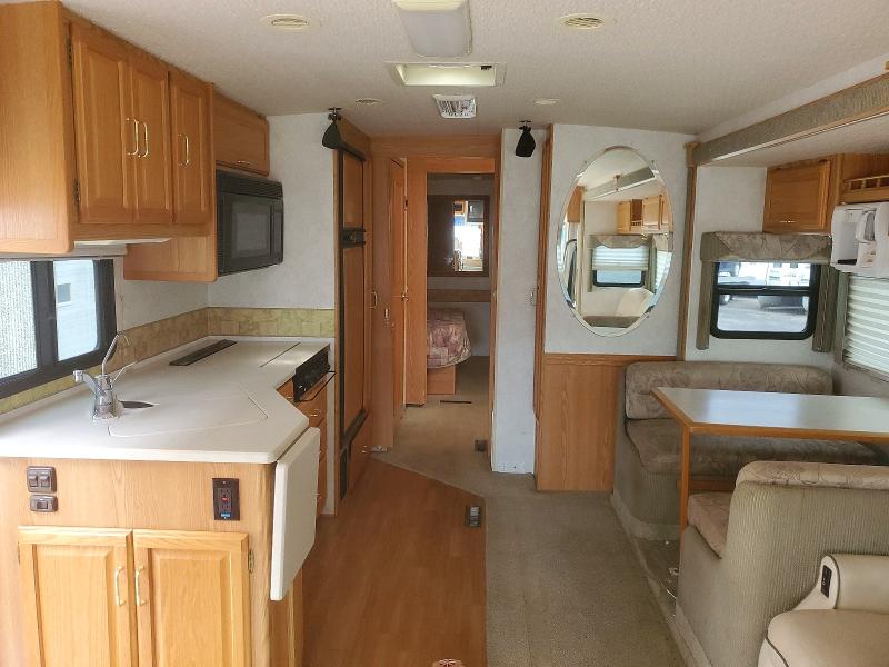 2003 Winnebago Adventurer VIN 5B4MP67G333361945 COPART salvage auction — REAR END, MN - CERT OF TITLE-SALVAGE FLOOD, sold $2,150 on 2026-10-01 (photo 6)