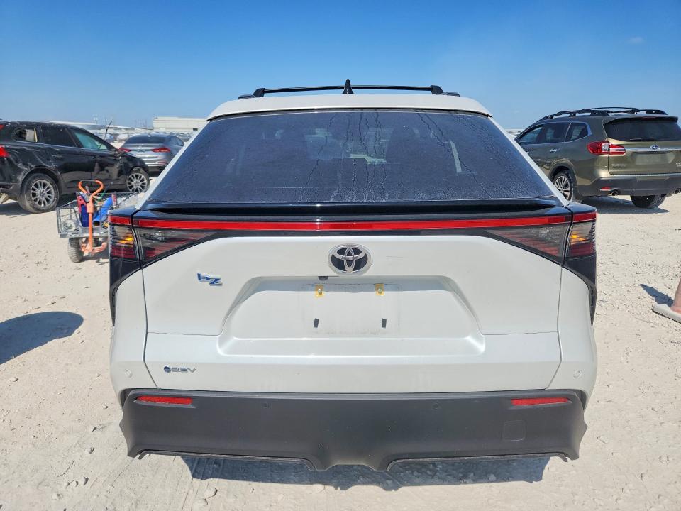 2026 Toyota Bz4x VIN JTMBCAEBXTJ007147 COPART salvage auction — SIDE, Tx - Salvage Vehicle Title, sold $10,600 on 2026-08-13 (photo 6)