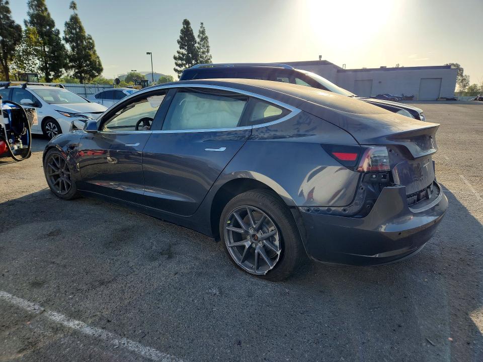 2018 Tesla Model 3 VIN 5YJ3E1EA3JF157661 COPART salvage auction — ALL OVER, CA - DIS/DLR/EXP ONLY CLEAN TITLE (P), sold $1,550 on 2026-10-08 (photo 2)