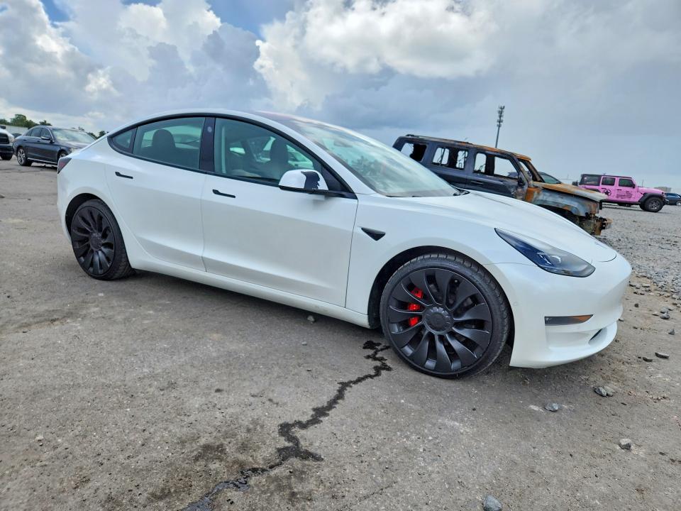 2021 Tesla Model 3 VIN 5YJ3E1EC2MF926480 COPART salvage auction — MINOR DENT/SCRATCHES, Fl - Cert Of Title-Rebuilt, sold $10,000 on 2026-08-28 (photo 4)